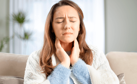 woman with sore throat