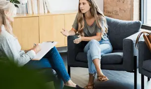 A woman during treatment with a therapist