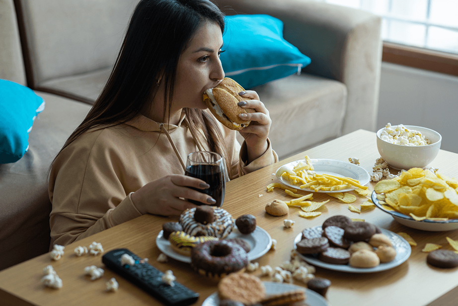 A girl eats a lot of food
