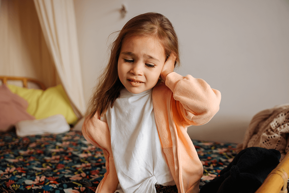 A girl who has a pain in her left ear