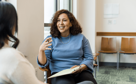 A woman talking to another woman